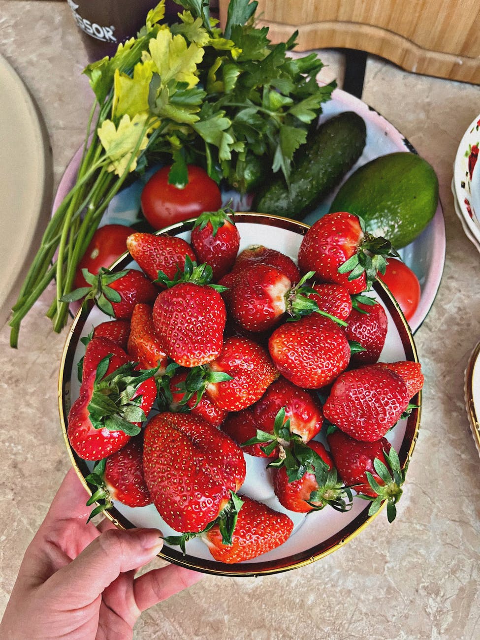 fresh strawberries with vegetables on kitchen counter